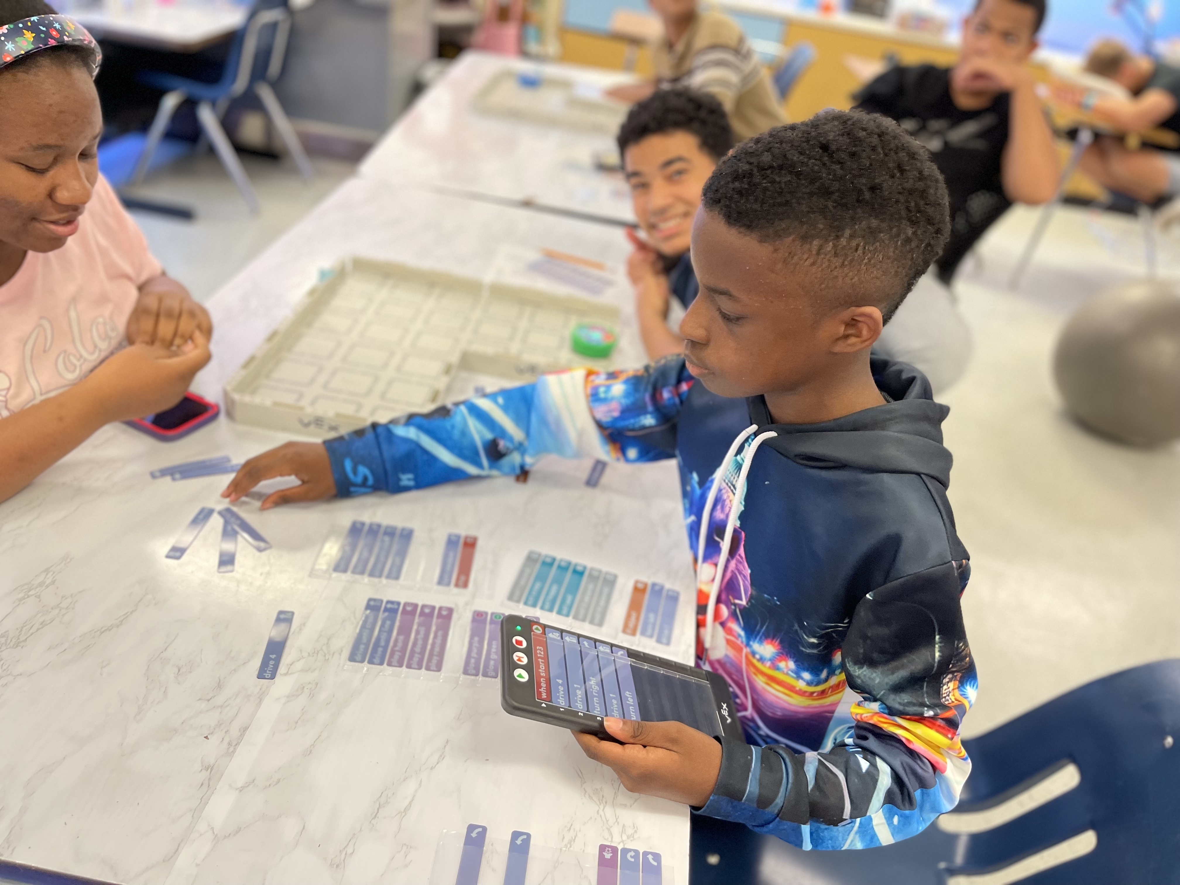 Student learning drag and drop coding